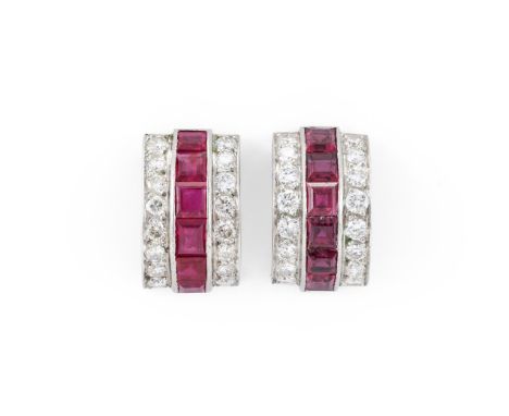 
	
		A PAIR OF RUBY AND DIAMOND CURVED EARRINGS 
		The curved rectangular panels with a central channel set row of step cut r