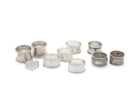 
	
		A COLLECTION OF SILVER NAPKIN RINGS
		To include: a set of four oval napkin rings by D. Bros, Birmingham 1929, with bead