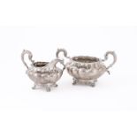 A WILLIAM IV IRISH SILVER LOBED CIRCULAR SUGAR BOWL AND CREAM JUG