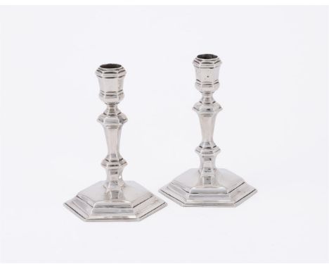 
	
		A PAIR OF VICTORIAN SILVER TAPER STICKS
		ALDWINKLE &amp; SLATER, LONDON 1884
		With hexagonal capitals, knopped stems a
