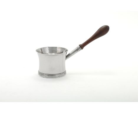 
	
		A GEORGE III SILVER BRANDY PAN
		SAMUEL MERITON II, LONDON 1796
		With a wooden handle and a flared rim
		23cm (9in) lon