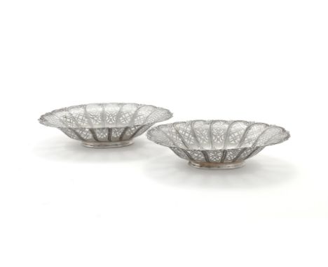 
	
		A VICTORIAN PAIR OF SILVER SHAPED OVAL PIERCED DISHES
		ELKINGTON &amp; CO., BIRMINGHAM 1894
		With pierced and beaded s