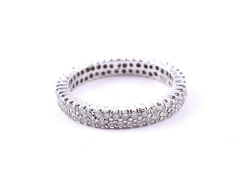 
	
		A DIAMOND ETERNITY RING
		The two rows of brilliant cut diamonds, approximately 0.88 carats total, stamped 750
		Size/di
