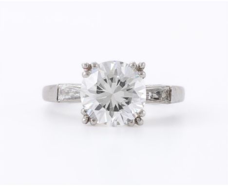 
	
		A DIAMOND AND CUBIC ZIRCONIA RING
		The central circular cut cubic zirconia with claw settings to the corners, to triang