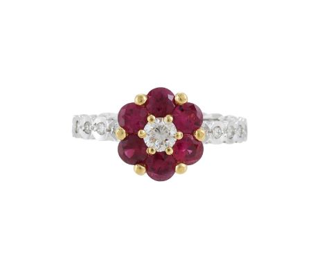 
	
		A RUBY AND DIAMOND CLUSTER RING 
		The central brilliant cut diamond within a surround of circular cut rubies, to a bril