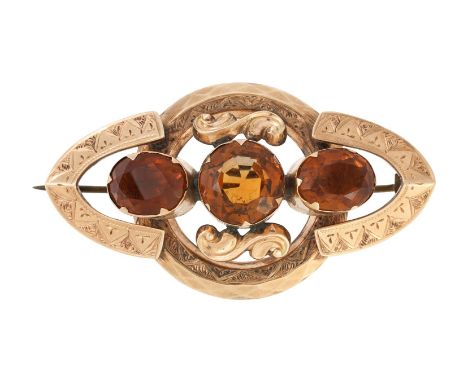 
	
		A VICTORIAN CITRINE ROLLED GOLD BROOCH 
		CIRCA 1870 
		The three oval and circular cut citrines within a rolled gold se