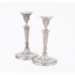 A PAIR OF EDWARDIAN SILVER CANDLESTICKS