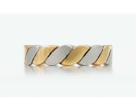 
	
		AN 18 CARAT GOLD AND PLATINUM BAND RING 
		SHEFFIELD 1990 
		of flattened ropetwist design, rubbed maker&#39;s mark
		Si