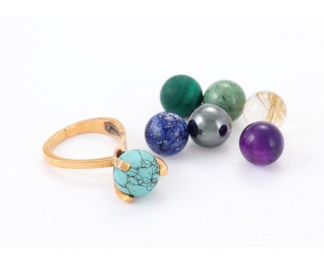 
	
		A DANISH RING WITH INTERCHANGEABLE BEAD ACCENTS 
		The raised claws with interchangeable hardstone beads, including turq