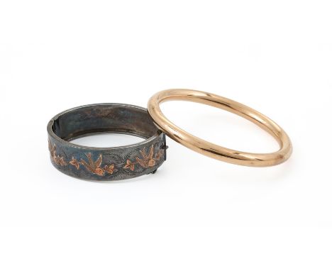 
	
		A 15 CARAT GOLD POLISHED HOLLOW BANGLE 
		BIRMINGHAM 1920 
		Together with a silver hinged bangle, Chester 1949, with ap