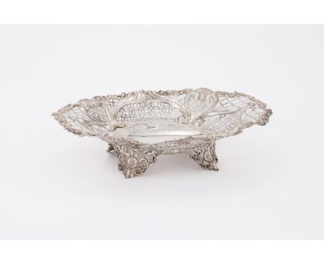 
	
		A VICTORIAN SILVER SHAPED OVAL BASKET
		WILLIAM HUTTON &amp; SONS LTD., LONDON 1894
		With a chased scroll and floral bo