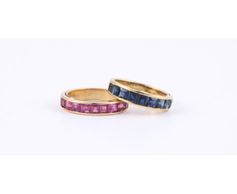 
	
		TWO GEM SET HALF ETERNITY RINGS  
		The first with step cut sapphires in gold coloured channel settings, unmarked; the s