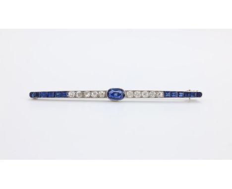 
	
		A 1930S SAPPHIRE AND DIAMOND BAR BROOCH 
		The central oval cut sapphire between a section of old mine cut diamonds, app