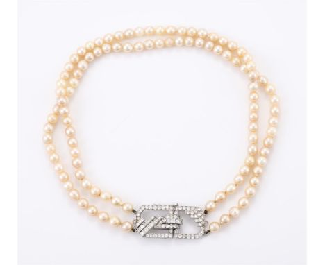 
	
		A TWO STRAND CULTURED PEARL NECKLACE WITH A DIAMOND CLASP 
		The two strands of uniform cultured pearls to a pierced geo