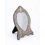 A LARGE VICTORIAN SILVER MOUNTED MIRROR