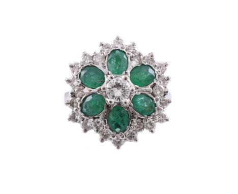 
	
		AN EMERALD AND DIAMOND FLOWER HEAD CLUSTER RING
		The cluster with a central brilliant cut diamond, claw set above six o