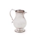 A GEORGE II SILVER BALUSTER SPARROW BEAK CREAM JUG