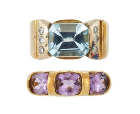 
	
		AN AQUAMARINE AND DIAMOND DRESS RING 
		The step cut aquamarine with canted corners to tapered shoulders each set with t