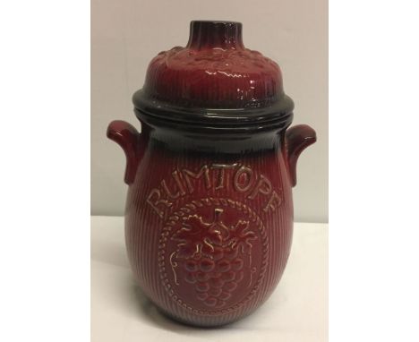 A large red and black ceramic rumtopf. 29cm tall approx.