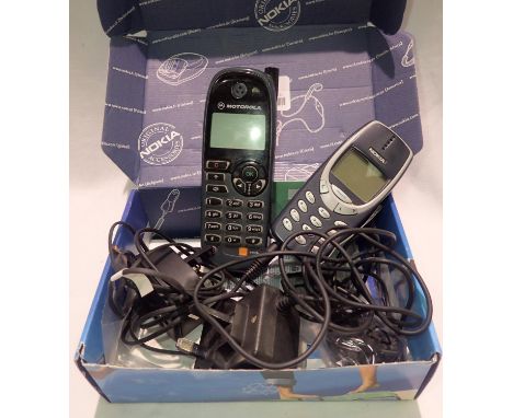 Two vintage mobile phones with cables and chargers to include Nokia 3310 example. P&amp;P Group 2 (£18+VAT for the first lot 
