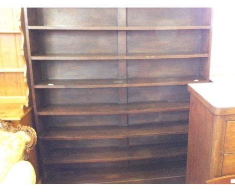 A stained Pine seven shelf open bookcase