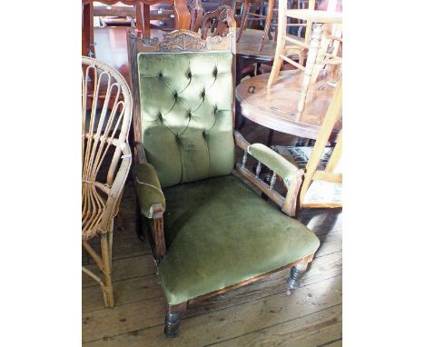 An Edwardian Mahogany green button back armchair