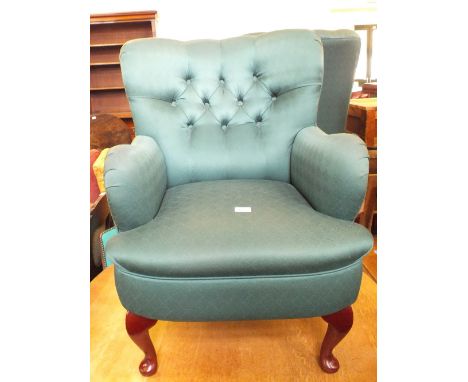 Two modern green upholstered button back armchairs