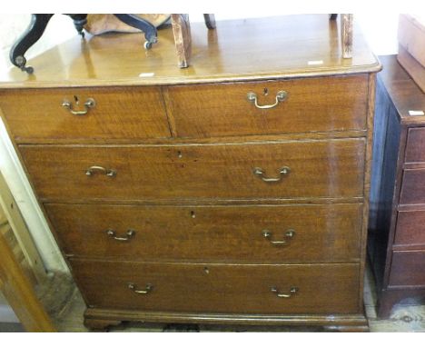 A 19th Century Oak chest of two short and three long drawers on bracket feet
