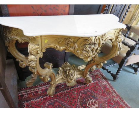 ANTIQUE CONSOLE TABLE, A gilt gesso foliate decorated console table on four shaped supports, with a white marble shaped top, 