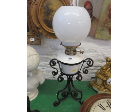 OIL LAMP, wrought iron supported oil lamp with glass chimney