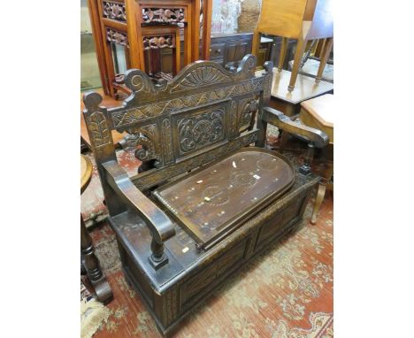 FLEMISH HALL SEAT, a carved back lift top seat hall bench, 40" width