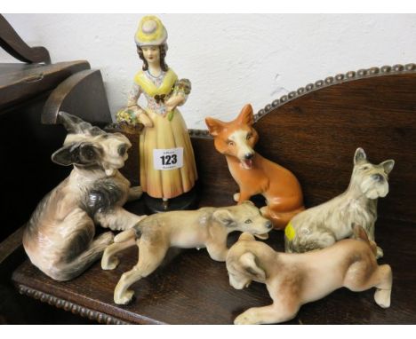 GOLDSCHEIDER FIGURE OF FLOWER SELLER, together with 3 Goldscheider puppies , fox figure and 1 other