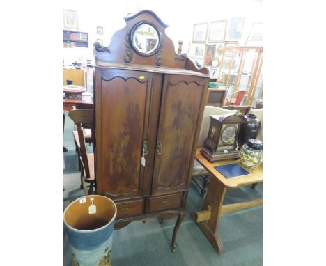 EDWARDIAN CABINET, mahogany twin door narrow cabinet with fitted shelf interior, bevelled glass inset mirrored back plate and