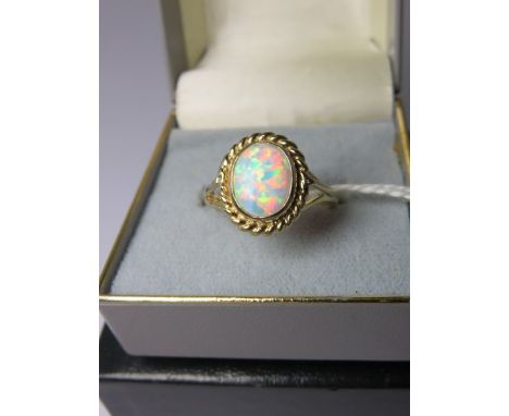 OPAL RING, 9ct yellow gold ring set an oval opal, size N/O