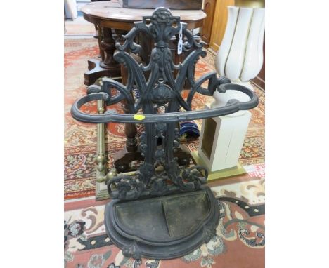 VICTORIAN STICK STAND, ornate cast iron pierced back stick stand