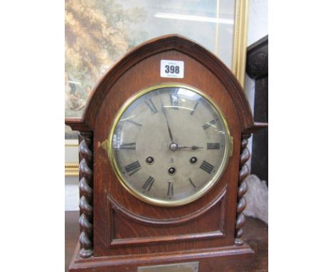 GUSTAV BECKER, oak arch cased bracket clock, with bar strike and barley twist column sides, 13.5" height