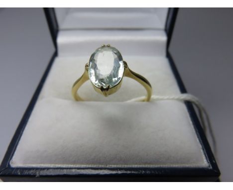 AQUAMARINE RING, oval aquamarine and diamond mounted 18ct yellow gold ring, size R/S