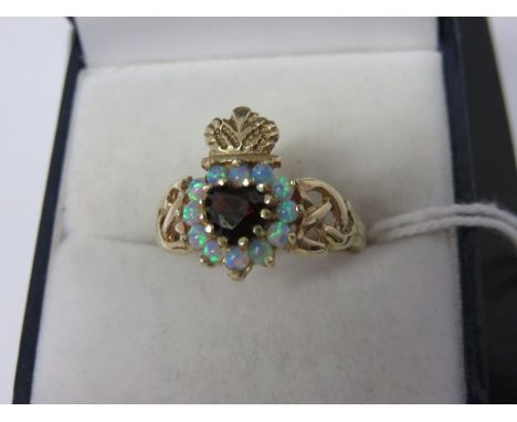 GARNET & OPAL RING, 9ct yellow gold garnet and opal ring with crown decoration, size O