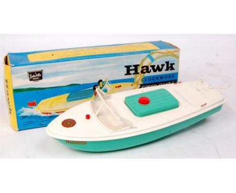 Sutcliffe boats, Hawk clockwork speedboat, light green and white body with red bung, flag and key, with original box (NM,BG)