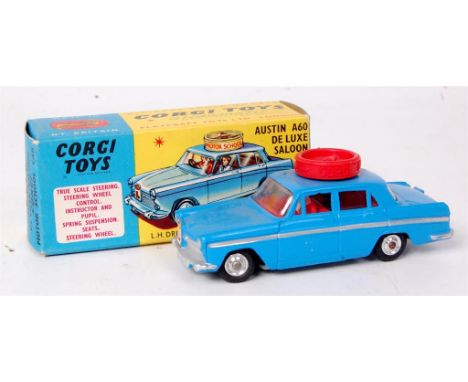 Corgi Toys, 255 Motor School A60, dark blue body with red interior, spun hubs, with 2 figures and red turning wheel, in the o