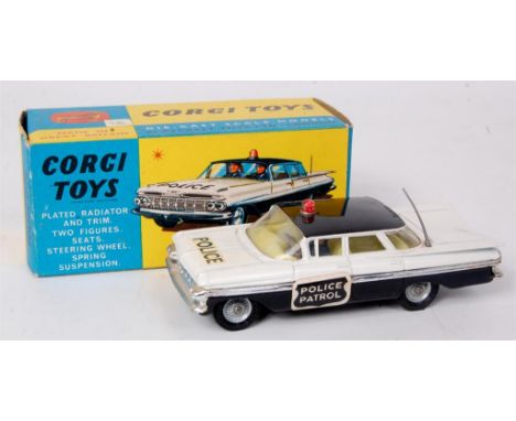 Corgi Toys, 481 Chevrolet police car, black and white body with black roof, red roof light with 2 policeman figures, with Pol