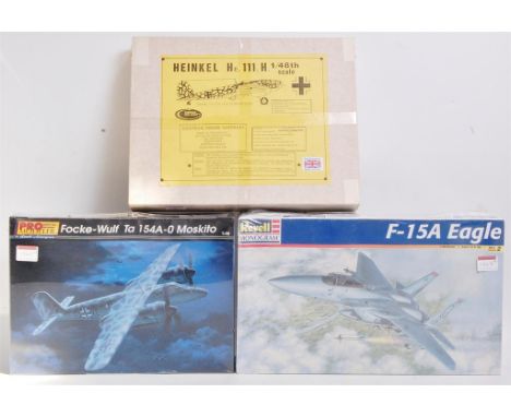 Three factory sealed plastic and vacform aircraft kits, to include; Revell USA F15A, Revell Monogram FW Ta 154-A Moskito, and