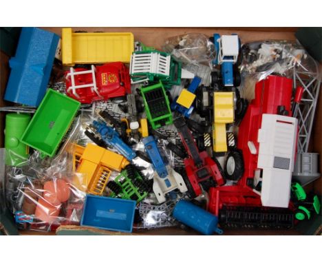 A quantity of Britains and similar farming diecasts and implement groups to include; Britains Ford 7710 tractor, some example