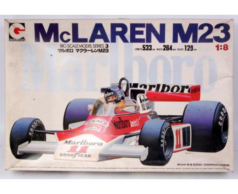 Eidai Grip, 1/8th scale plastic kit for a McLaren M23 F1 racing car, appears as issued, unmade example with transfers, conten