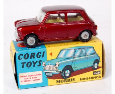 Corgi Toys, 226 Morris Mini Minor, metallic maroon with lemon interior and detailed cast hubs, in the original blue and yello