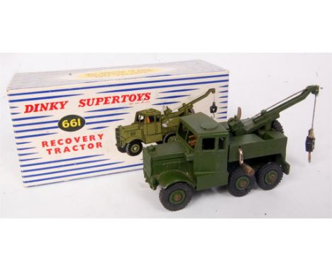 Dinky Toys, 661 Military Recovery tractor, military green body with green hubs, operable crane, in the original blue and whit