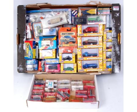 Two trays containing a quantity of 1/76th, 00 and small scale diecast and plastic vehicles, by Herpa, Classix, Schuco, Base T