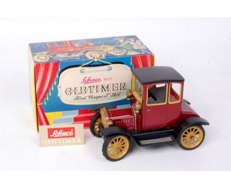Schuco, No.1227 Old Timer Ford Coupe 1917, tinplate and clockwork, maroon body with tin-printed detailing, mustard hubs, in t