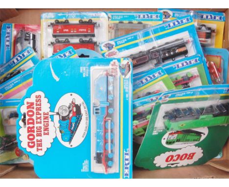 21 carded ERTL Thomas the Tank Engine diecast trains and rolling stock to include, BOCO, Gordon, Duck and others 