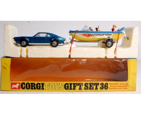 Corgi Toys, gift set 36, Oldsmobile Toronado and Speedboat set comprising No.276 Oldsmobile Toronado in dark metallic blue wi